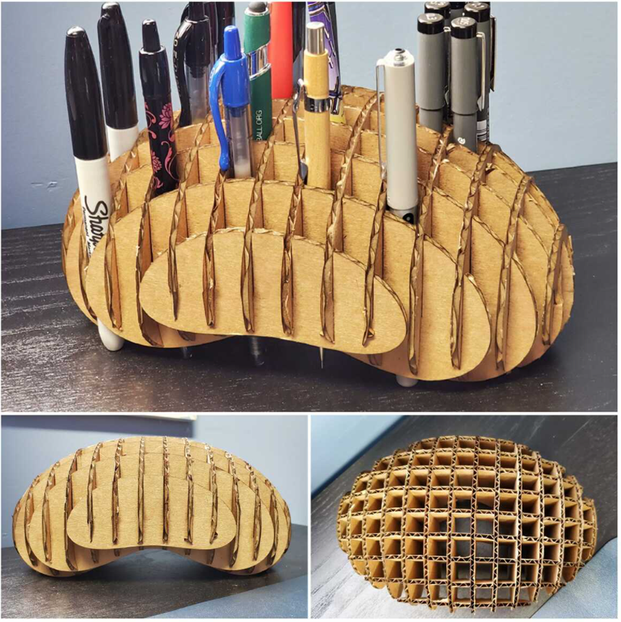 This cardboard laser carved pen holder can hold a lot of pens.