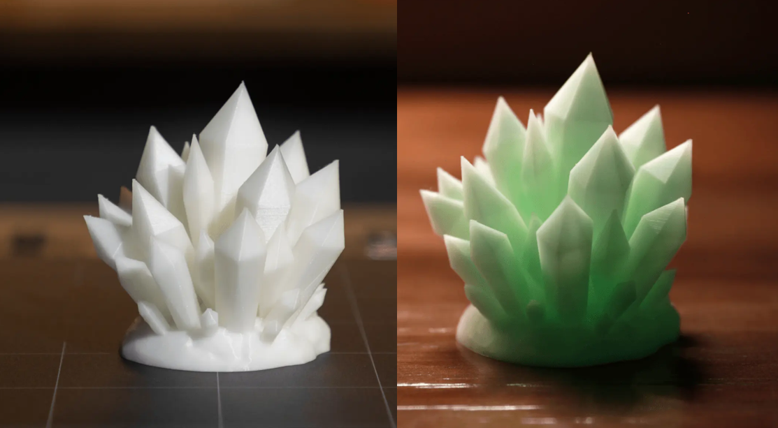 A side-by-side comparison of a 3D printed crystal model, showing it as white in the light and glowing green in the dark.