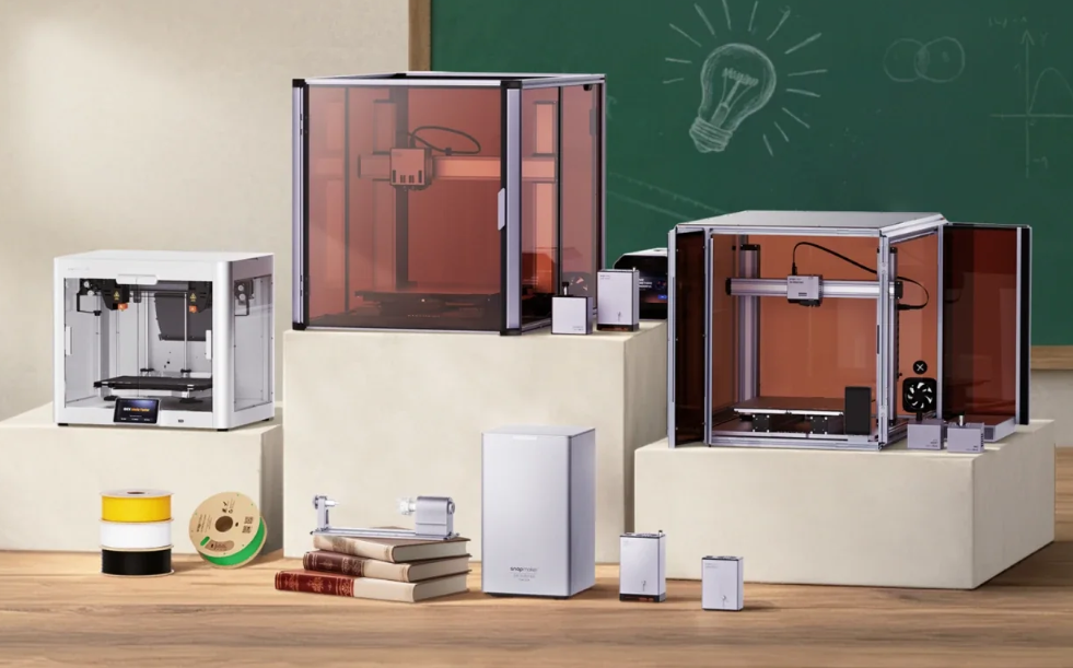 A collection of different Snapmaker 3D printers and accessories, showcasing the ecosystem of machines available for makers.