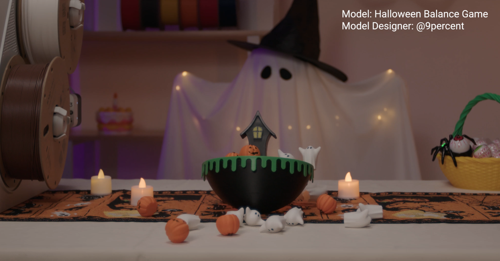 The 3D-printed Halloween balance game is shown on a table after being played, with several ghost and pumpkin pieces having fallen off.