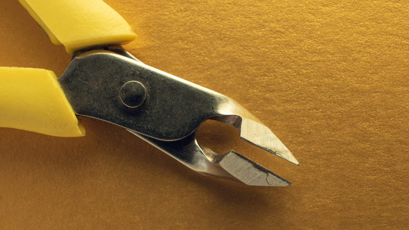 A close-up of yellow-handled flush cutters, an essential post-processing tool for trimming plastic supports and a highly practical gift for any 3D printing enthusiast.