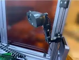 DIY 3D printer camera mount attached to a Snapmaker 3-in-1 printer frame, showing a custom monitoring setup.