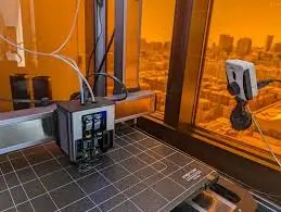 Professional 3D printer setup with an external camera for full monitoring of the Snapmaker Artisan multi-material print process.