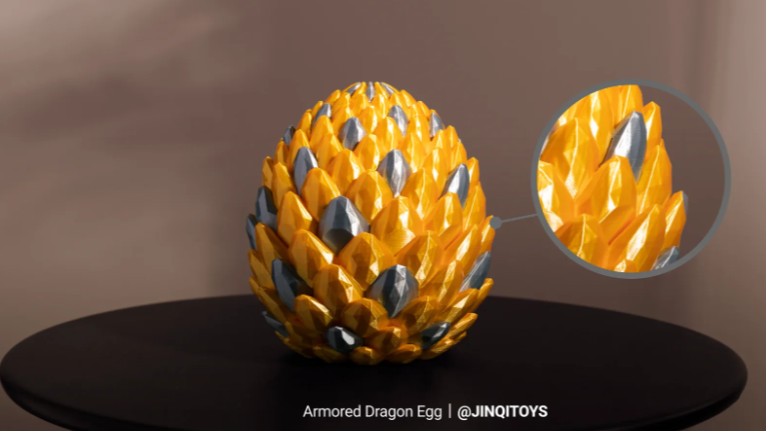 Armored dragon egg printed in Silk PLA, showcasing dual-color sheen and layer texture.