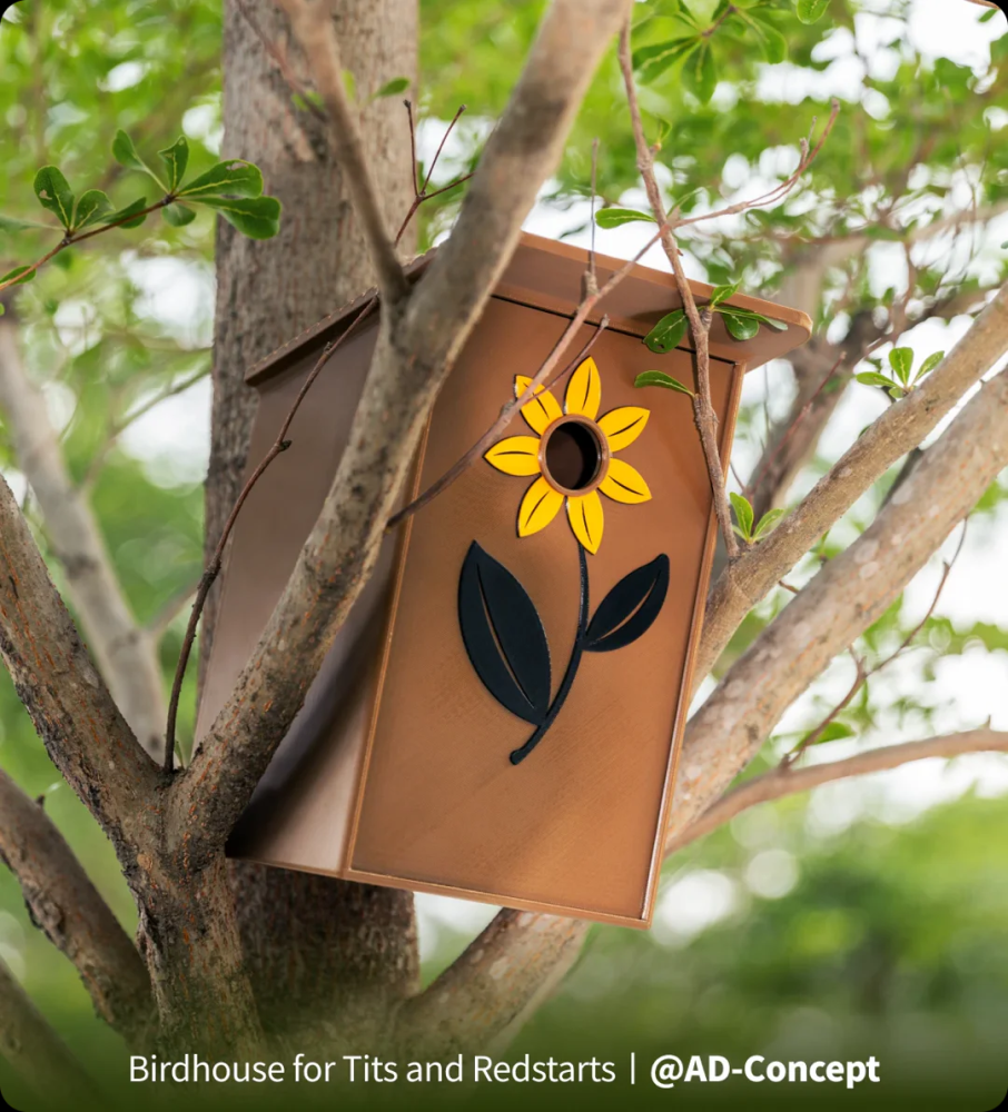 A brown 3D printed birdhouse with a yellow flower design mounted in a tree, demonstrating the practical outdoor heat resistance of PETG filament.