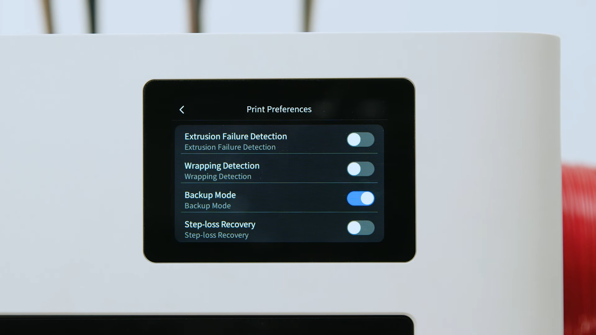 A close-up of a 3D printer's operating system touchscreen interface displaying advanced print preferences and execution layer safeguards, such as extrusion failure detection and step-loss recovery.