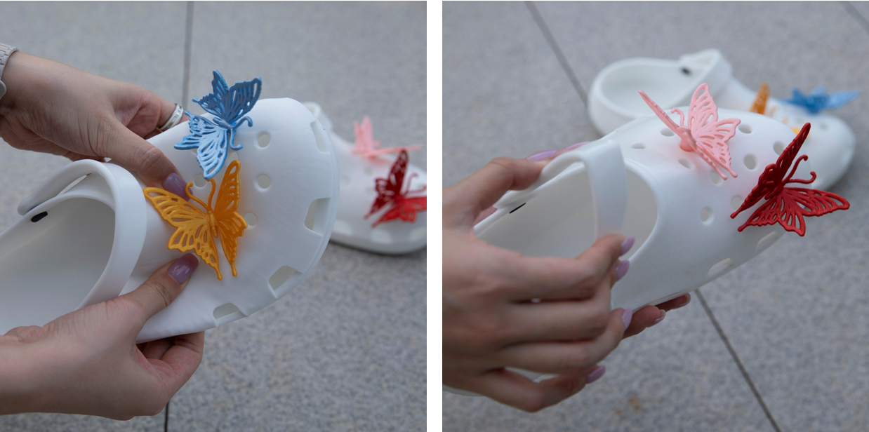 A close-up view showing hands bending a 3D-printed white TPU clog to demonstrate the material's flexibility and comfort.