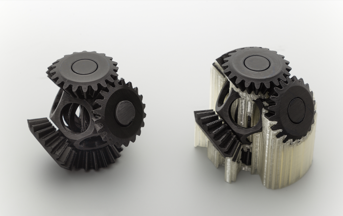 A 3D-printed gear assembly shown in two stages: with its dissolvable PVA support structure attached, and as a clean, finished part after removal.