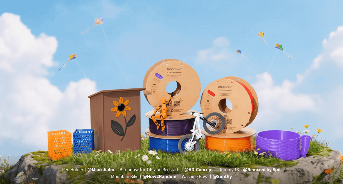 A collection of Snapmaker filament spools displayed alongside functional 3D printed models like a birdhouse and pen holders, illustrating the versatile applications of the material.