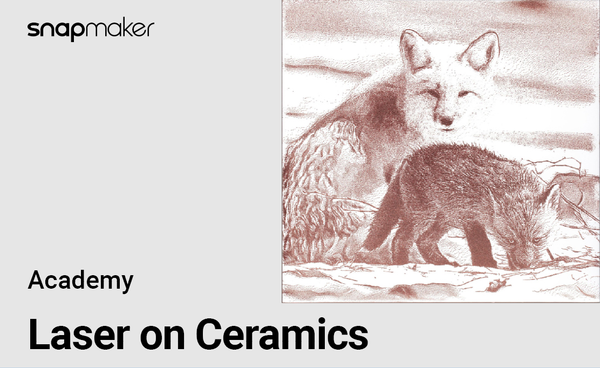 A laser-engraved image of a fox and a smaller animal, possibly a cub, on a white background. The image is light brown and sketch-like.