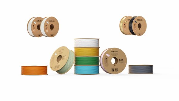 An assortment of colorful Snapmaker 3D printer filament spools, illustrating the wide variety of material choices available for FDM 3D printing.