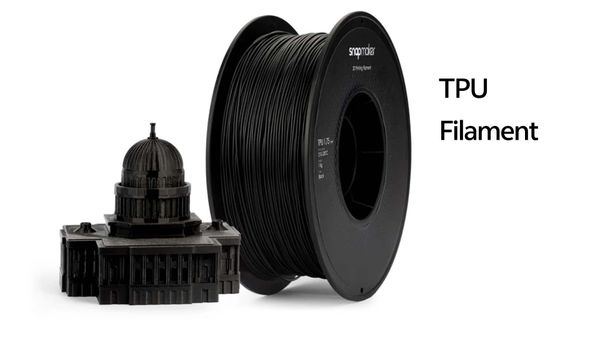 A spool of black TPU filament is displayed next to a detailed 3D-printed model of the Capitol building, illustrating the quality achievable with this material.