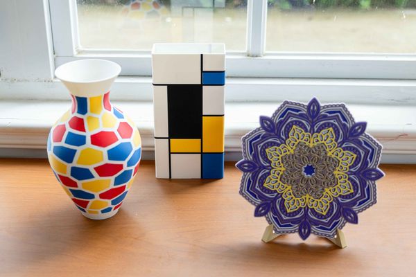 Vases of various shapes and styles are arranged on the table.