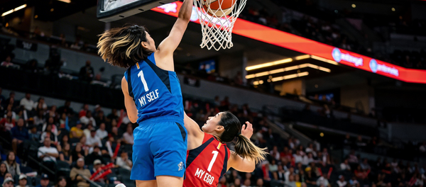 Two women basketball players in a live packed arena — player in blue jersey #1 reading "MY SELF" dunking on woman in red jersey reading "MY EGO"