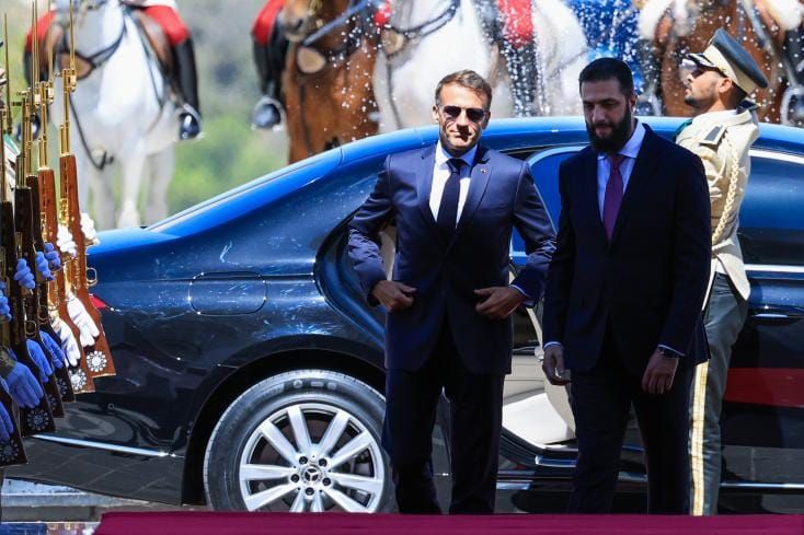 Two bombs rock Damascus as Macron meets Syrian president, wounding 18 in a blow to al-Sharaa's stability drive