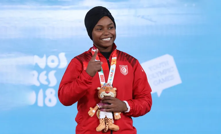Weightlifter Ghofrane Belkhir says she has not changed her Tunisian nationality as Germany speculation grows