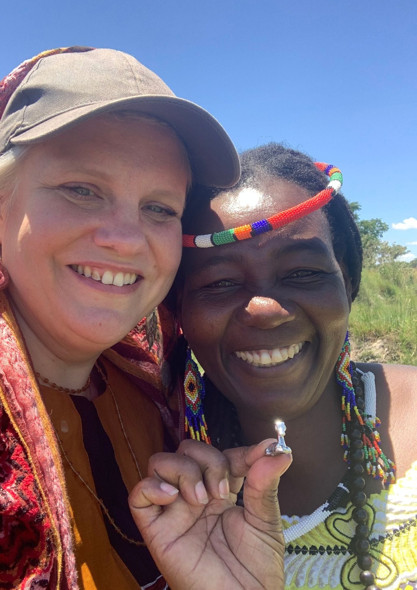 Two women smiling at the camera

AI-generated content may be incorrect.