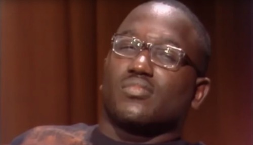The actor Hannibal Buress squinting with sceptisicm.