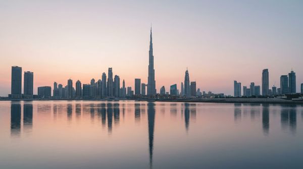 The Dubai skyline at dawn, calm and clear, representing an Australian founder setting up a Dubai company