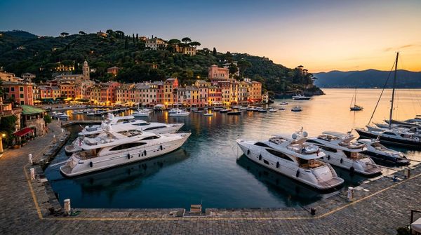 A Mediterranean harbour full of yachts at dusk