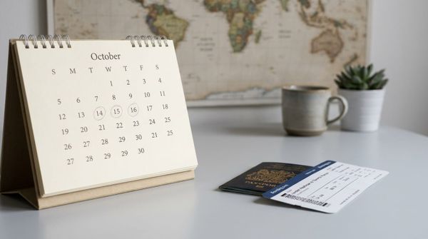 A desk calendar with marked days, a UK passport and a boarding pass