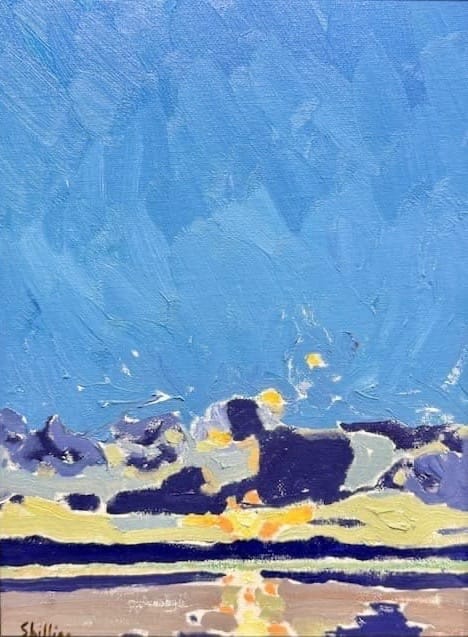 A landscape in blues, purples and yellows cleaves water and a clear blue sky.
