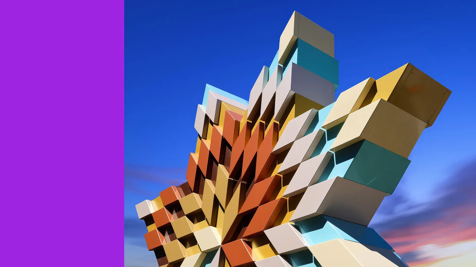 Viewed from below, a large multicoloured star sculpture punctuates a blue and purple sky.
