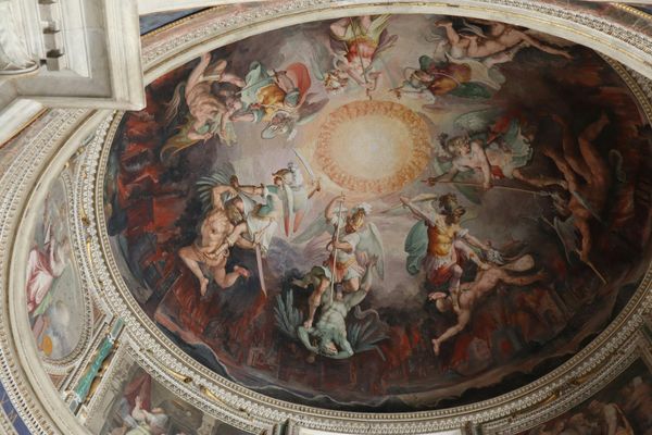 A Renaissance-era painted ceiling of angels doing some pretty gory and mean things to presumed demons