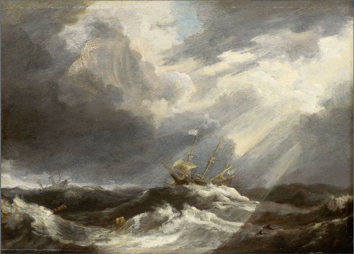 A ship runs through stormy waters but a ray of sunshine breaks through the clouds above.