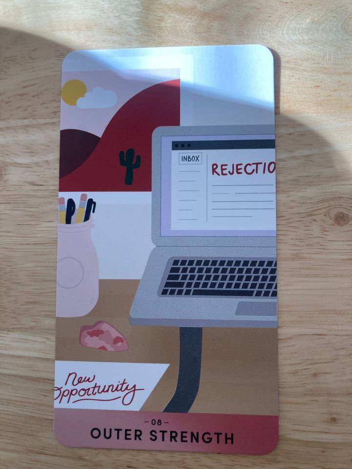 An illustration showing a desk with both an emailed rejection letter and a "new opportunity" letter on it.