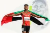 Editorial portrait of a UAE sprinter holding the national flag