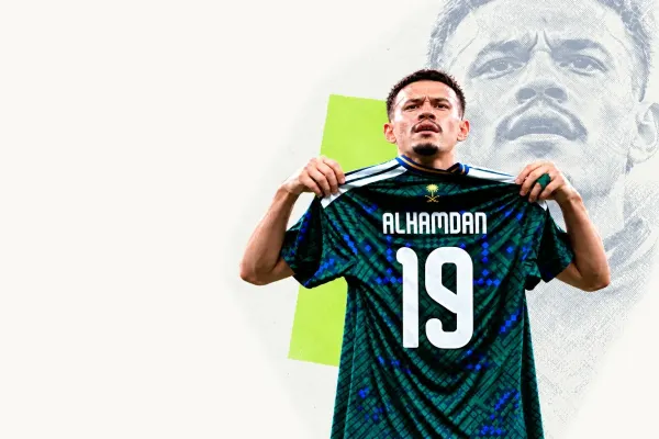 Abdullah Al Hamdan holding his Saudi Arabia shirt