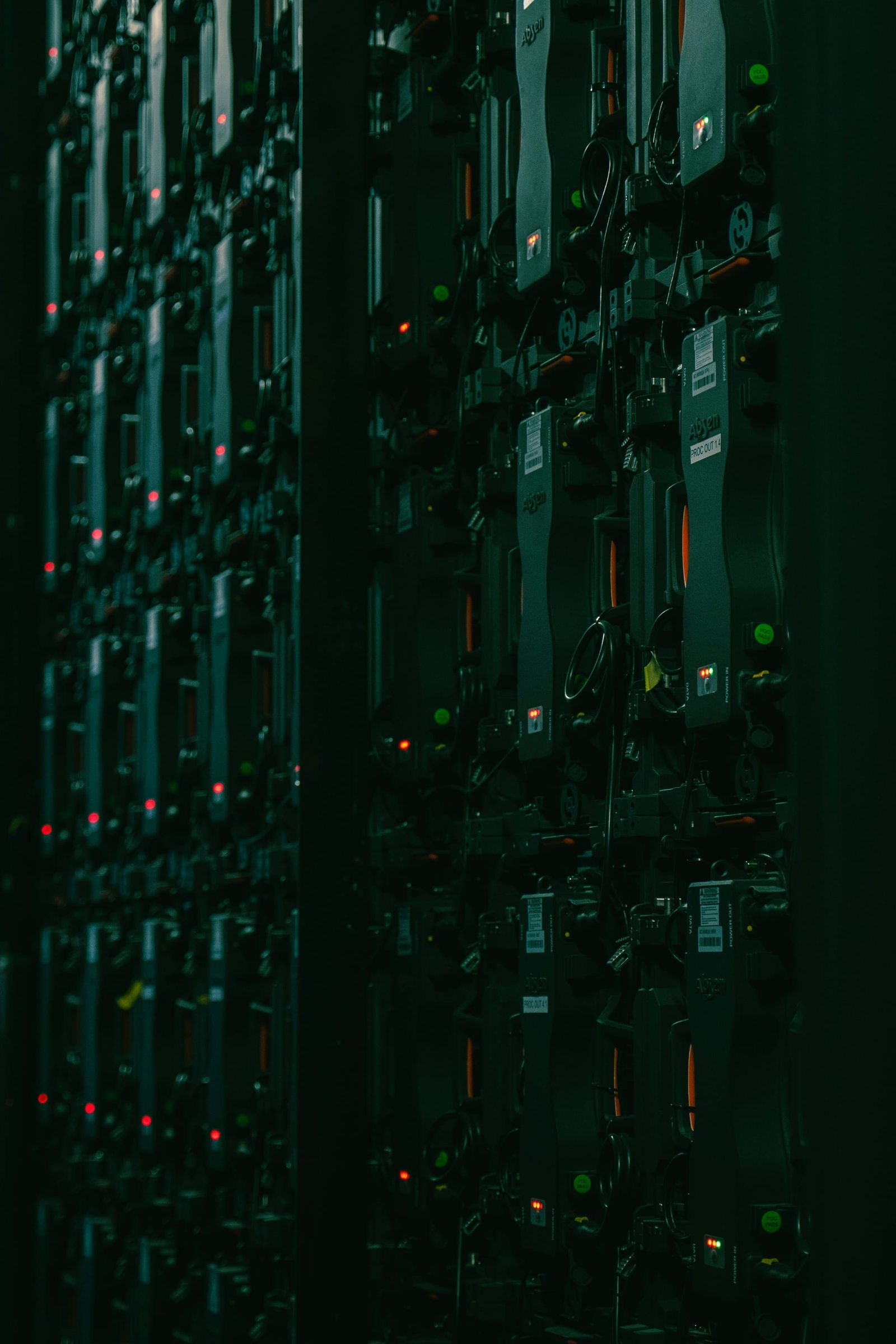 Rows of server racks in a data center - data center electricity forecast