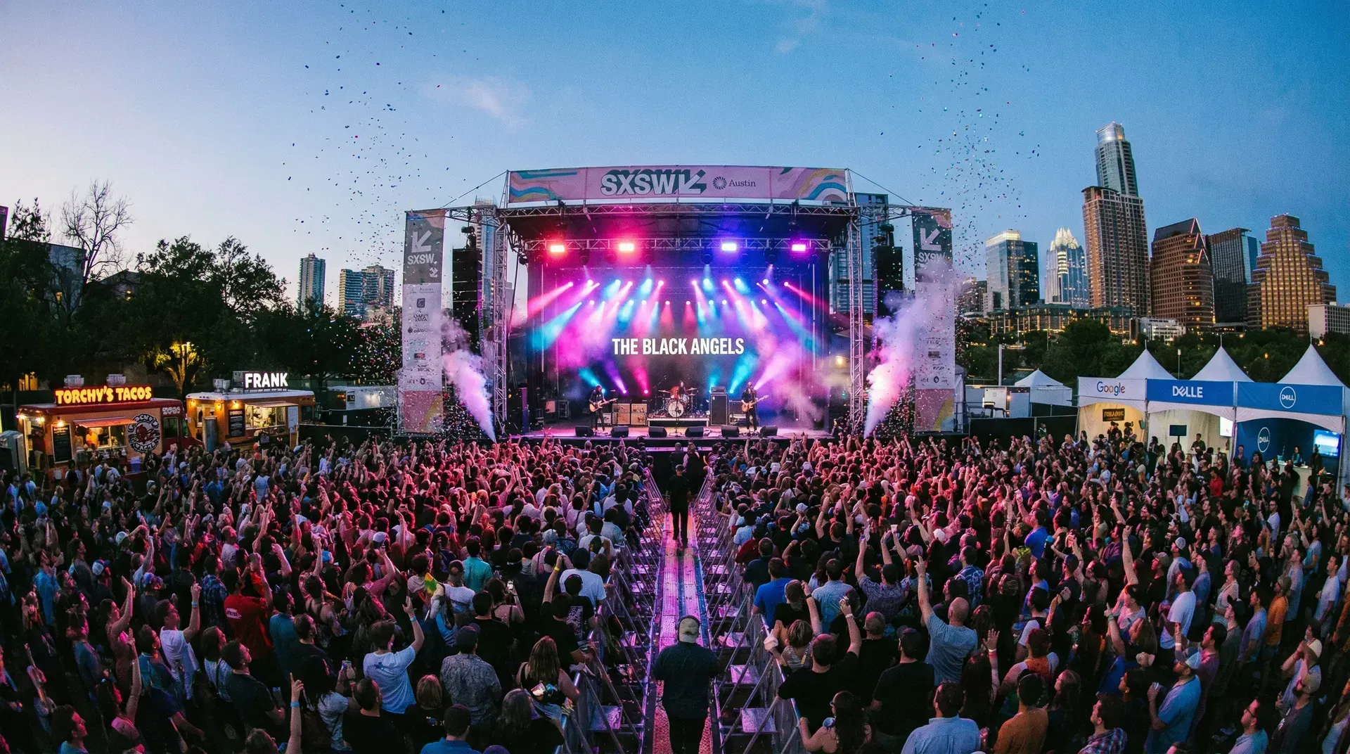 Diverse crowd at SXSW, bright lights, technology, and culture converging.