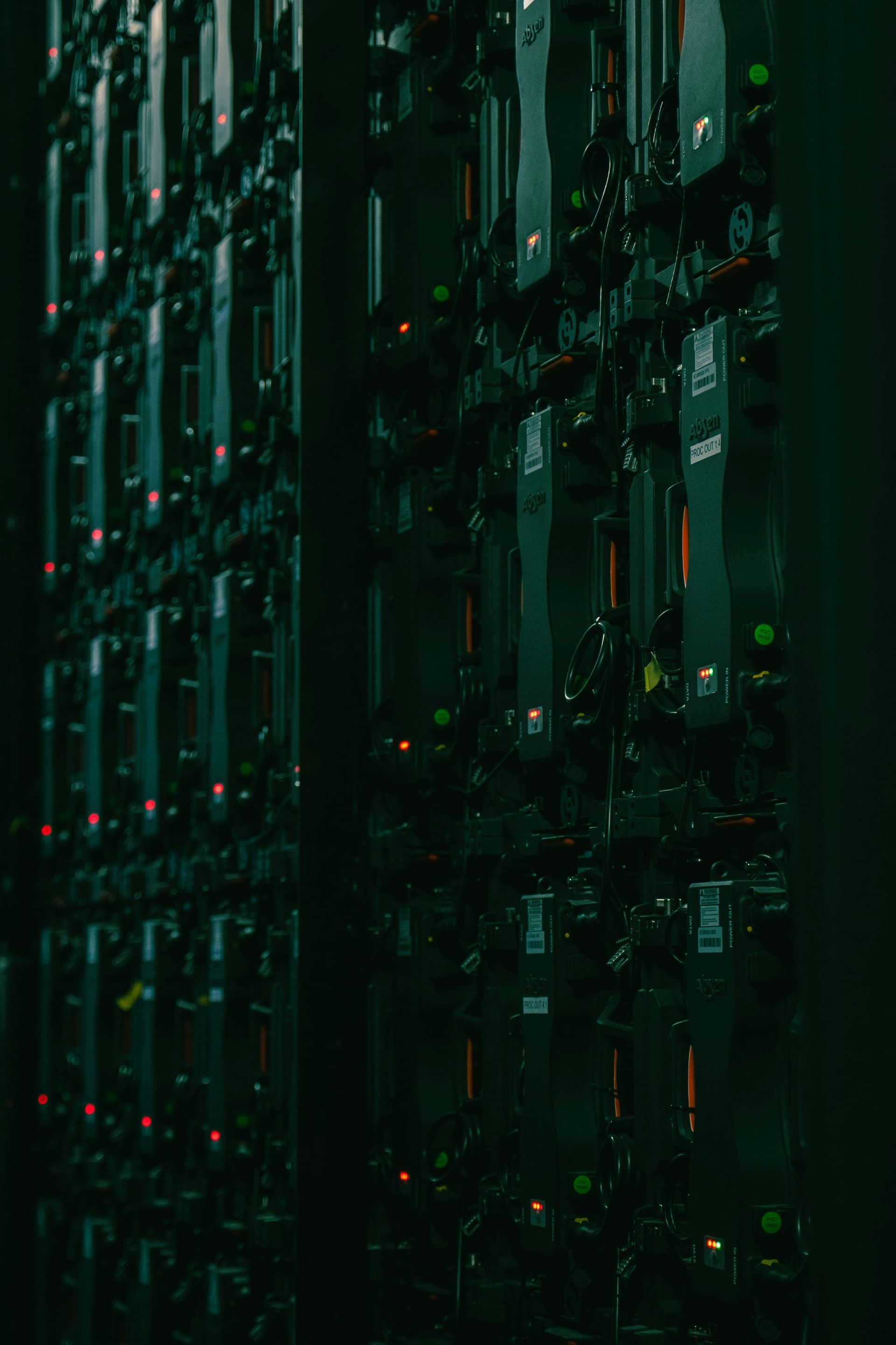 Rows of server racks in a data center - data center electricity forecast