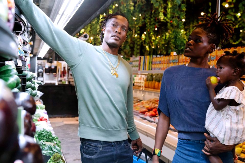 Family choosing fresh produce in a supermarket aisle - U.S. GDP growth