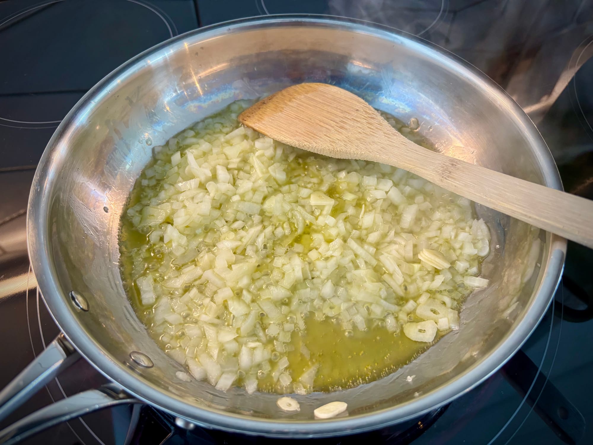 Onions, garlic and olive oil, cooking in a skillet