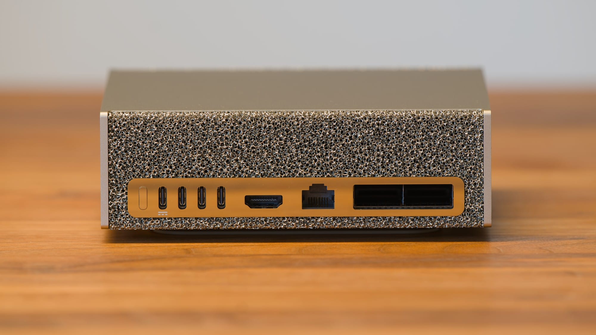 Rear ports and ventilation openings on an NVIDIA DGX Spark on a wooden desk