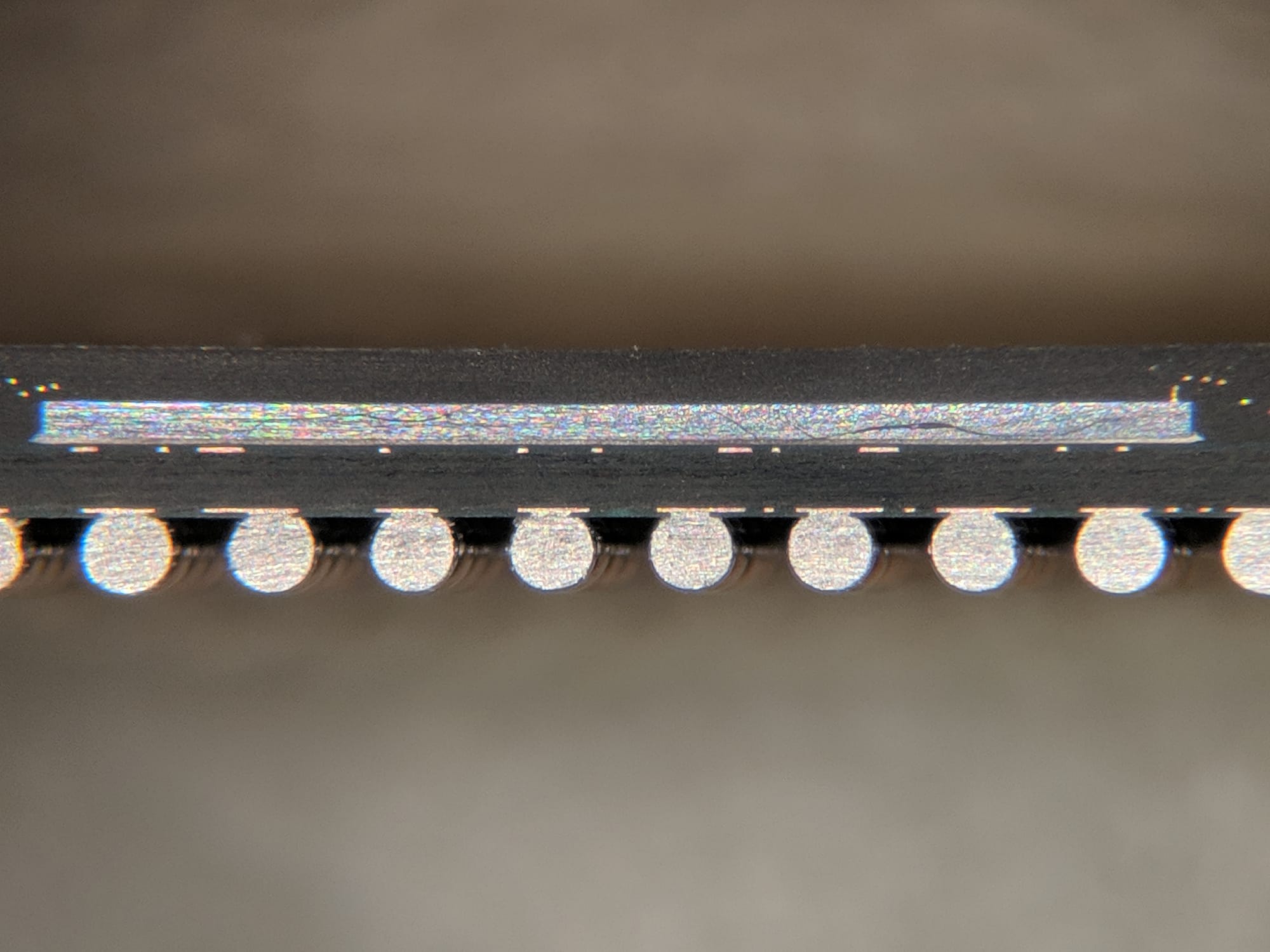 Cross section of a BGA chip package with a die above a row of solder balls