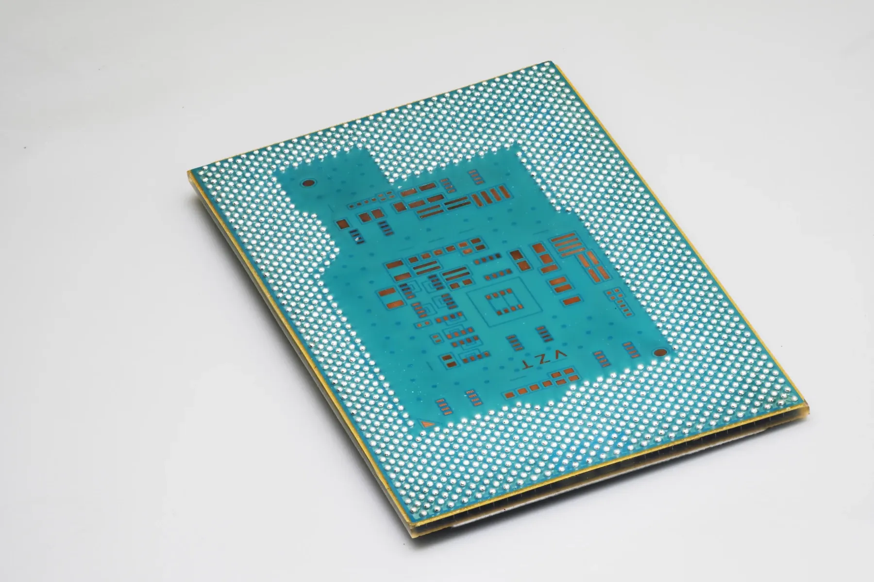 Ball-grid-array underside of an Intel glass-substrate test package photographed in Chandler in July 2023