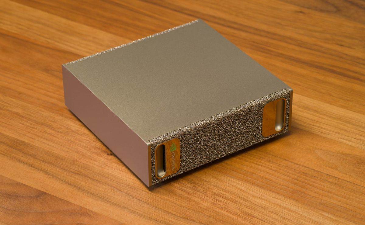 Front and top of an NVIDIA DGX Spark on a wooden desk
