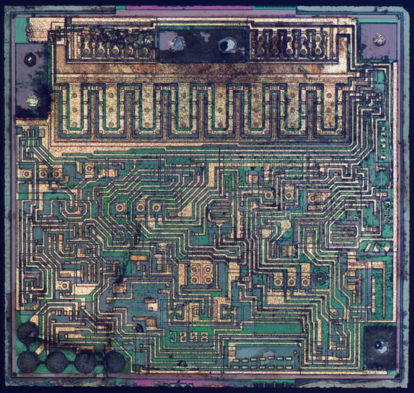 Context image: color-enhanced LM1117 regulator die identified by ZeptoBars; manufacturer and package variant unverified.