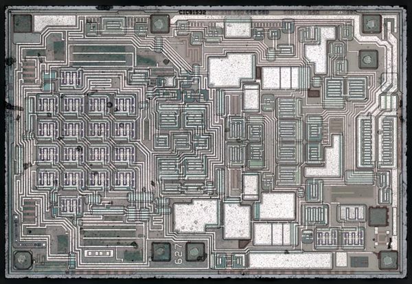 Context image: a historical OPA627 operational-amplifier die photographed by ZeptoBars, not an ADC die.