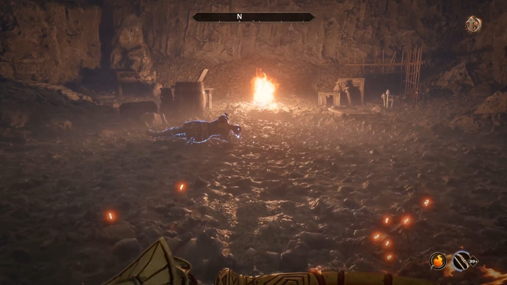 A dead bandit in front of a small campsite.