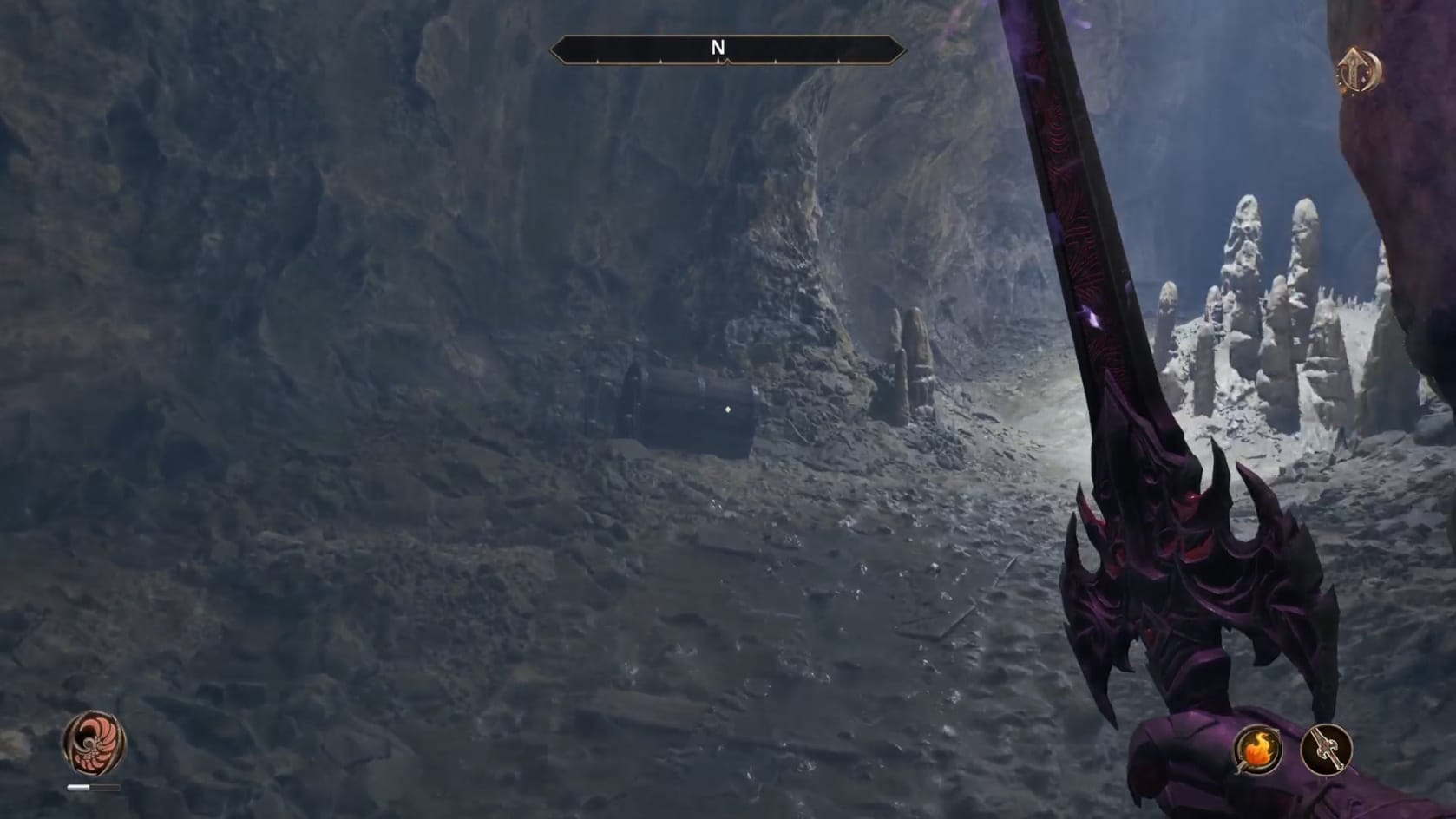 An empty chamber with a rise to the right and a chest directly in front