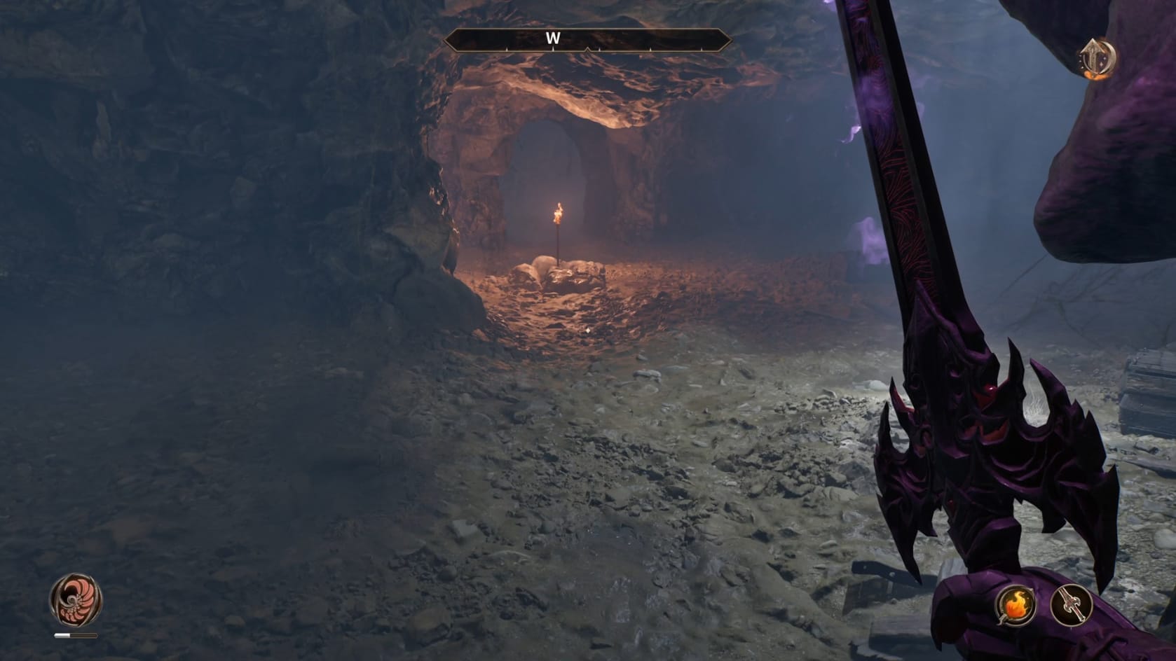 A mostly empty chamber with a distance torch blazing in the center
