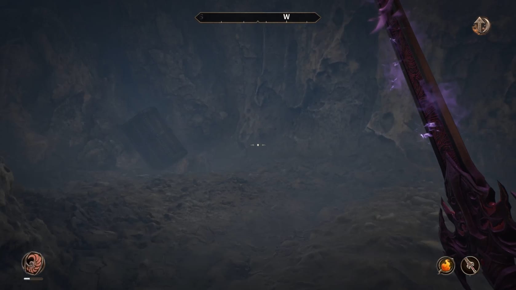 A chest sits on its side, at a steep angle against a rock wall