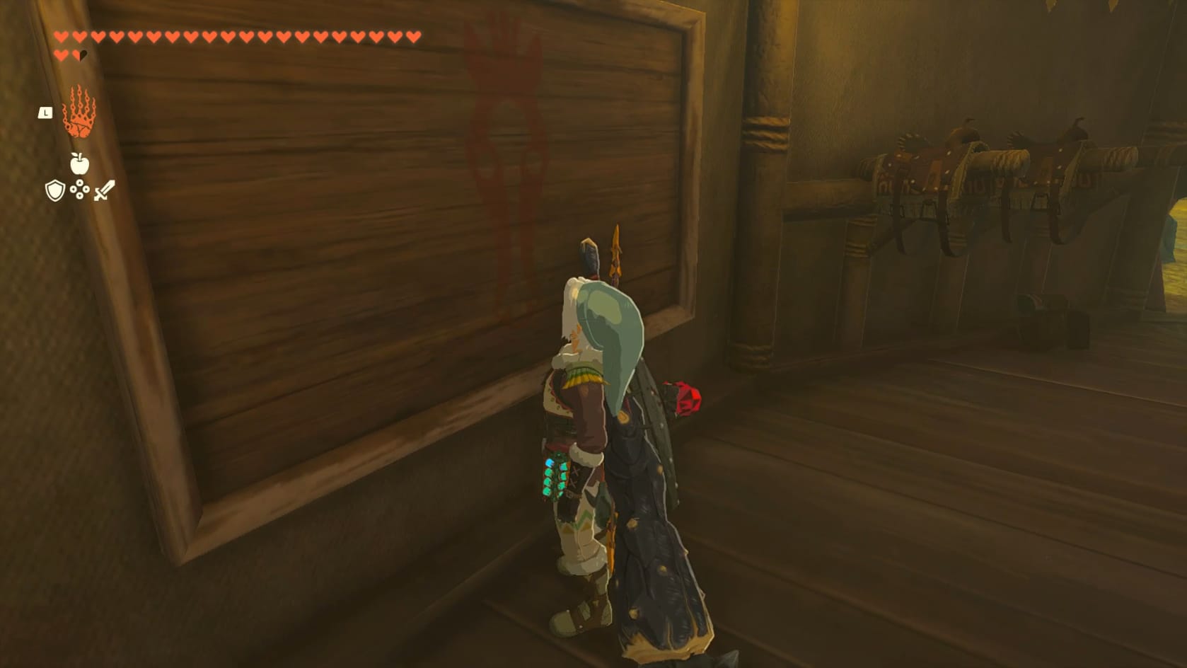 Link looking at an empty frame with a faint red horse head emblem in the middle