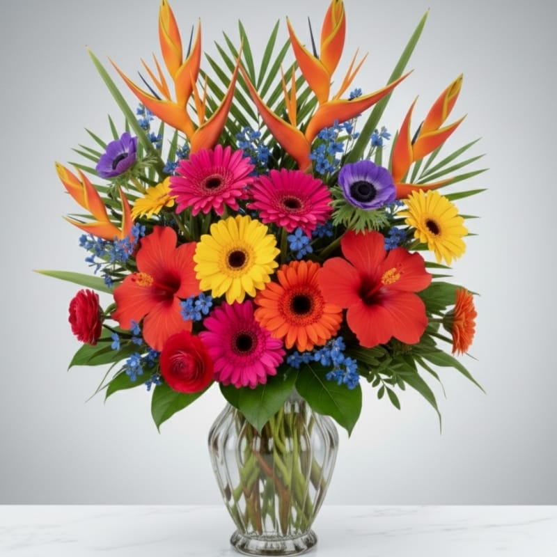 A vibrant and colorful Purim floral arrangement with pink and orange roses and hydrangeas, designed by Grace & Blooms luxury florist in Naples, Florida.