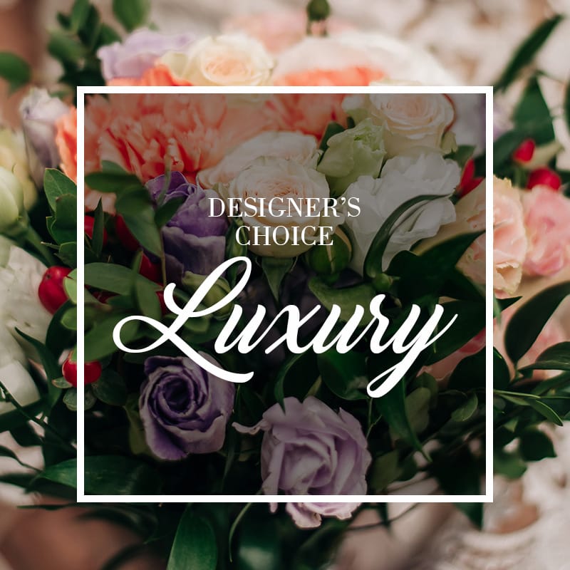 A 'Designer's Choice' luxury bouquet with soft purple roses, peach carnations, and white lisianthus by Grace & Blooms, your Naples florist for custom flower delivery in Pelican Bay.